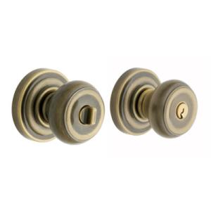 Baldwin Colonial Knob Antique Brass Keyed Entry Sets